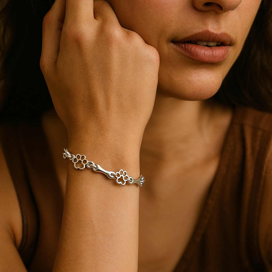 Silver bracelet with dog paw and bone charm